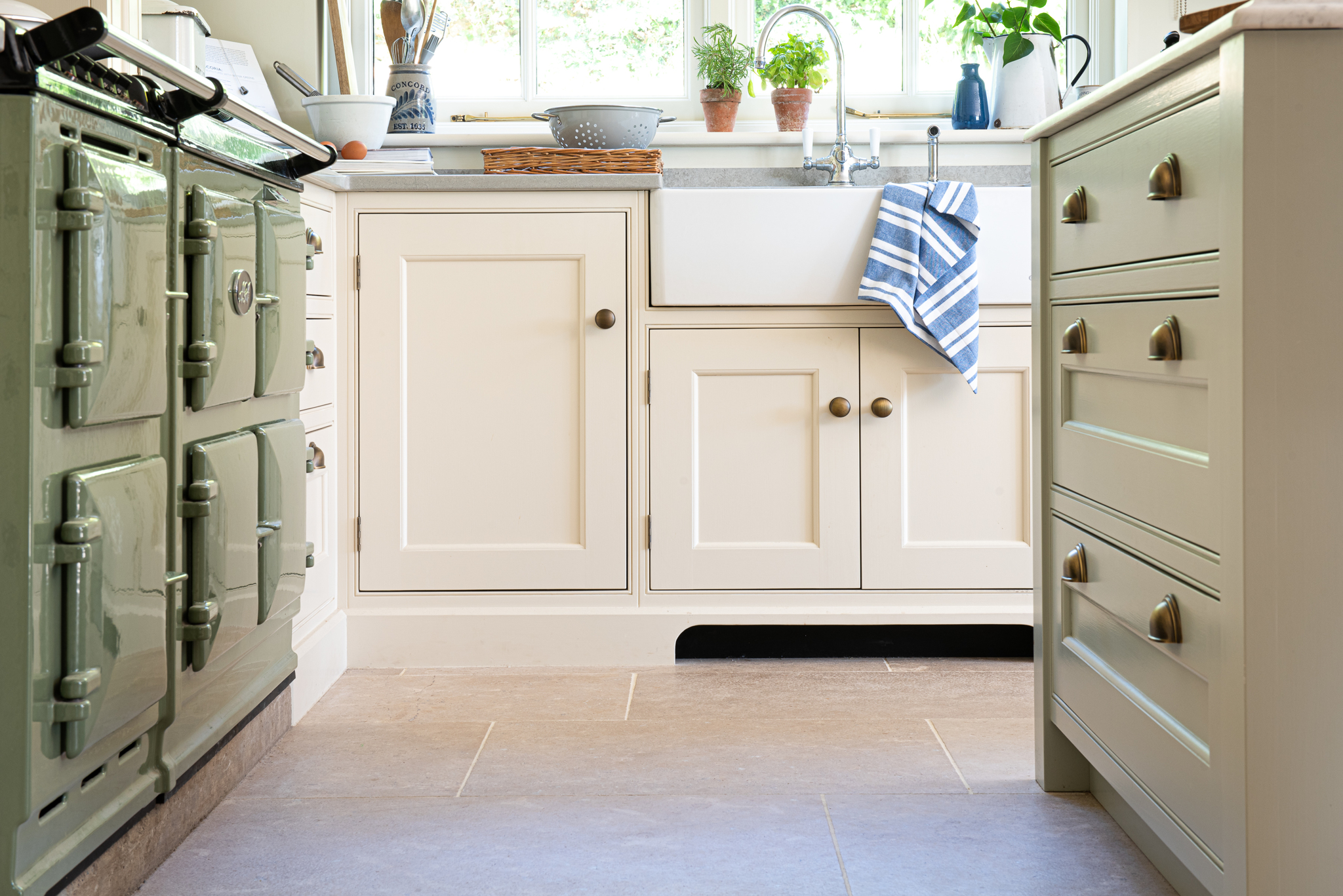 Vintage provence stone floor tile in sage green and cream white kitchen