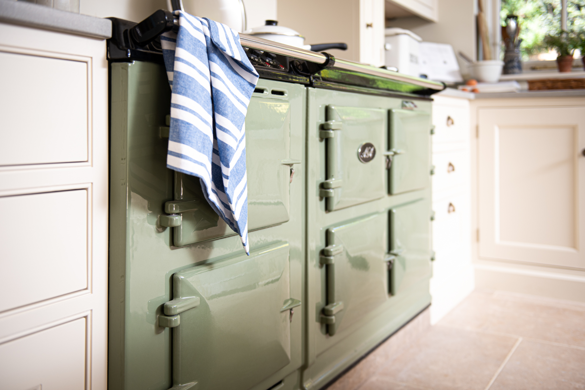 vintage provence limestone flooring tile with cream kitchen & sage green aga